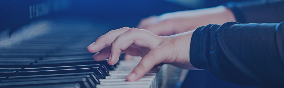 image of student's hands playing piano